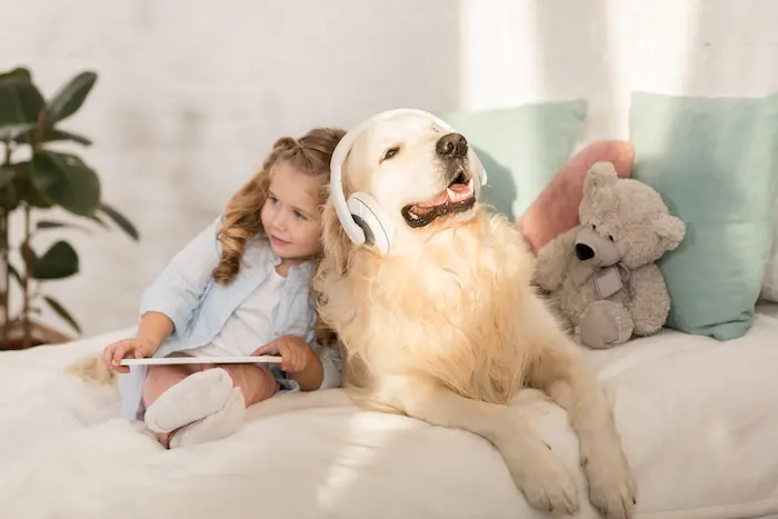 Dog listening to music with a child